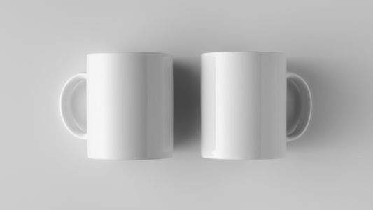 two coffee mugs on a surface