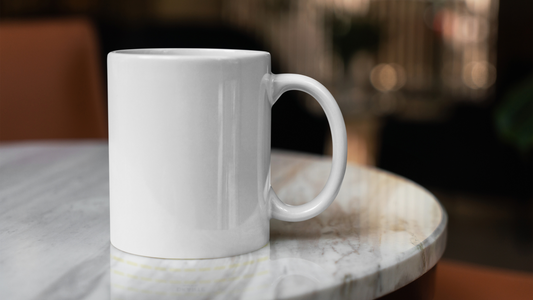 a coffee mug sitting on top of a marble table