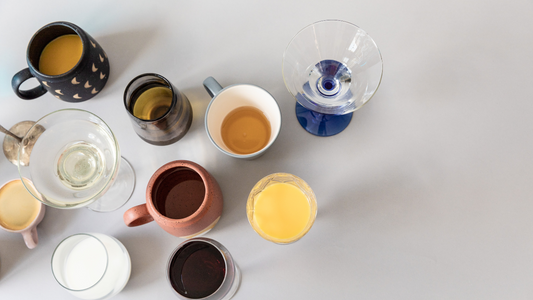 various types of coffee and tea are arranged on a table